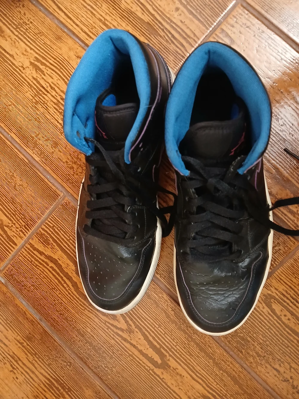 Classic Air Jordan high tops. Black with pink wing logo and blue